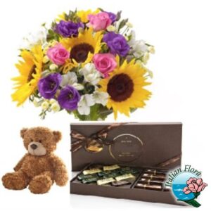 Bouquet di fiori colorati con peluche e cioccolatini