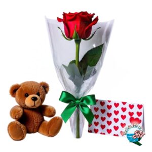 Orsetto di peluche con cartolina e una rosa rossa