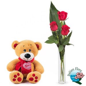 Tre rose rosse con peluche